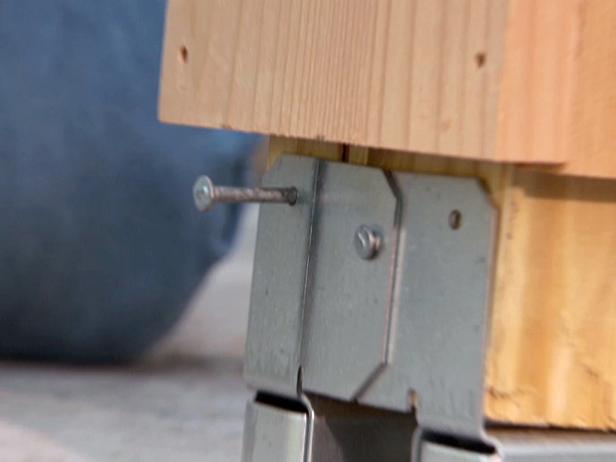 metal braces secured to stone or concrete surface metal braces secured to stone or concrete surface