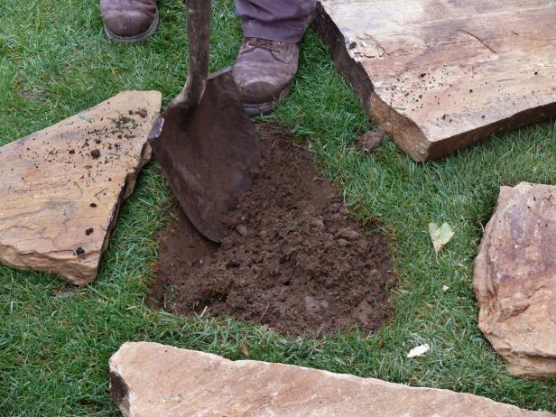 If using thicker stones, you can set them directly on the soil without crusher run. Dig a hole in the soil of the same size and shape as the stone.