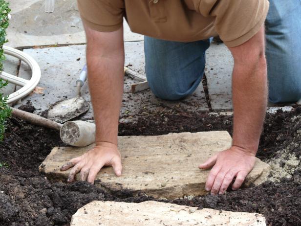 Check the stones for stability by rocking back and forth on each with your full weight.