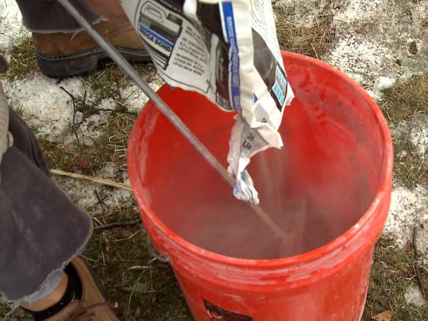 Mixing mortar solution to do floor installation using plank tile in this home improvement project.