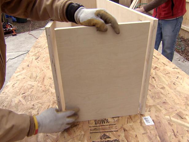 Assembling wooden bench pieces to add to banquette furniture project.