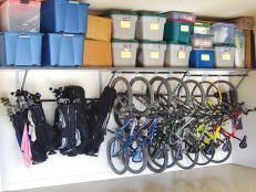 Rate My Space photo - bike storage and golf club storage - plastic crates stored on shelf in garage. 