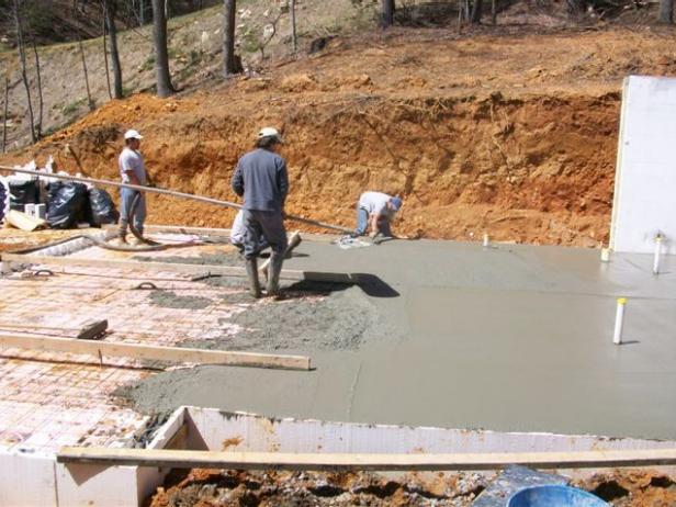 Crew Levels Surface of the Blog Cabin Slab Surface of Blog Cabin is Leveled
