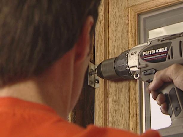 Secure top sash by screwing the top brackets into the window frame and the sash. Pre-drill the holes if necessary.