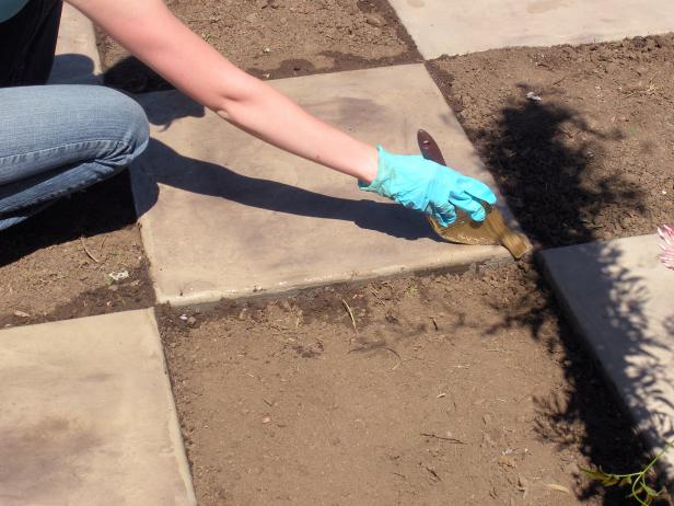 Apply a sealer by brush to protect the concrete once it has set up which takes about 24 hours.