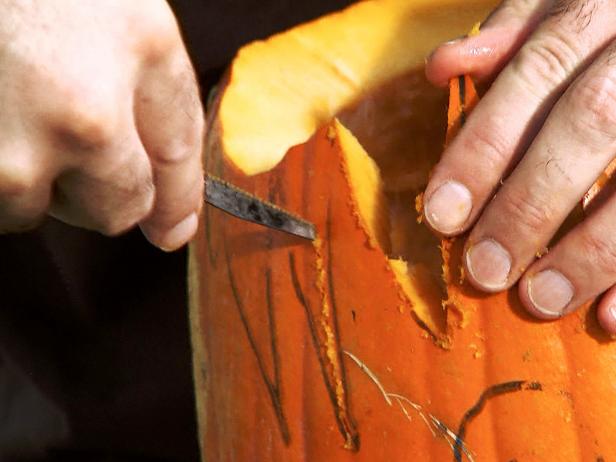Cut each hair spike individually. Start at the bottom of each spike and work your way up, cutting triangular pieces out from between each spike. Make your way around the entire pumpkin.