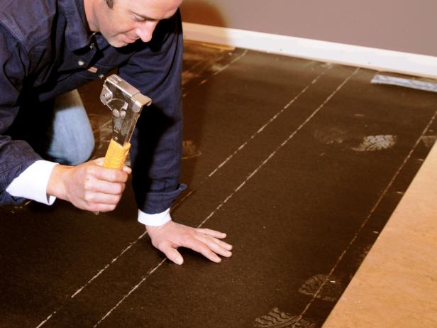 Ultimate-How-To-Hardwood-Floor_tack-under-layment_s4x3 Ultimate-How-To-Hardwood-Floor_tack-under-layment_s4x3