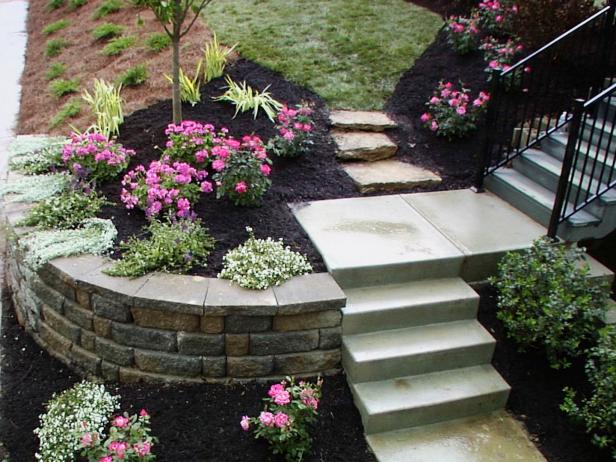 Garden With Rock Retaining Wall After Landscaping Makeover Garden With Rock Retaining Wall After Landscaping Makeover