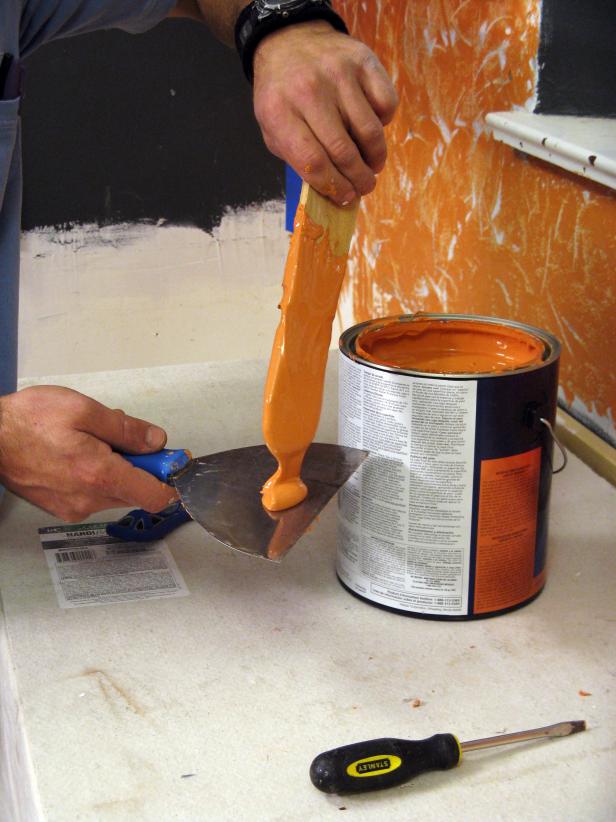 Drop a dollop of plaster on one spatula before applying to wall.