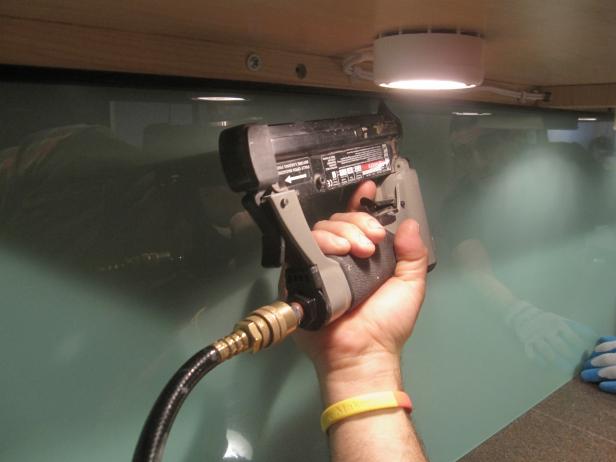 Using a power nailer to install under cabinet molding