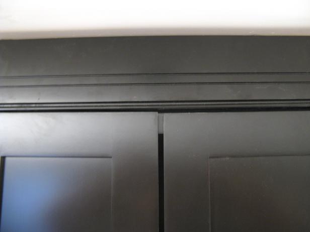 Gaps in the black cabinet doors.