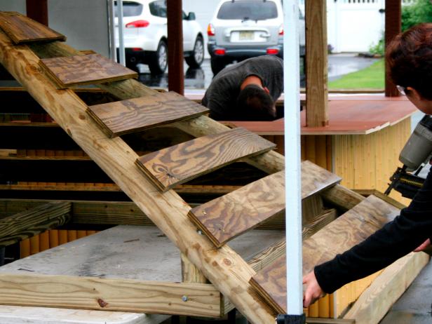 Use framing nails to attach the plywood to the posts. Leave roughly four inches between each piece of plywood.