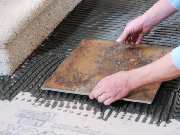 Setting first tile on the floor thinset.