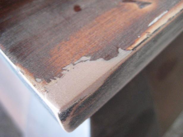 After scoring the damaged corner to increase adherence, apply a filler like Bondo and sand.