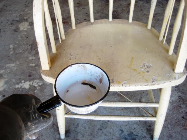 Apply stripper to all painted surfaces with a chip brush – we used an old cooking pot as a reservoir for the stripper. Wait 5 to15 minutes and then use a putty knife to scrape off the paint as it bubbles up.