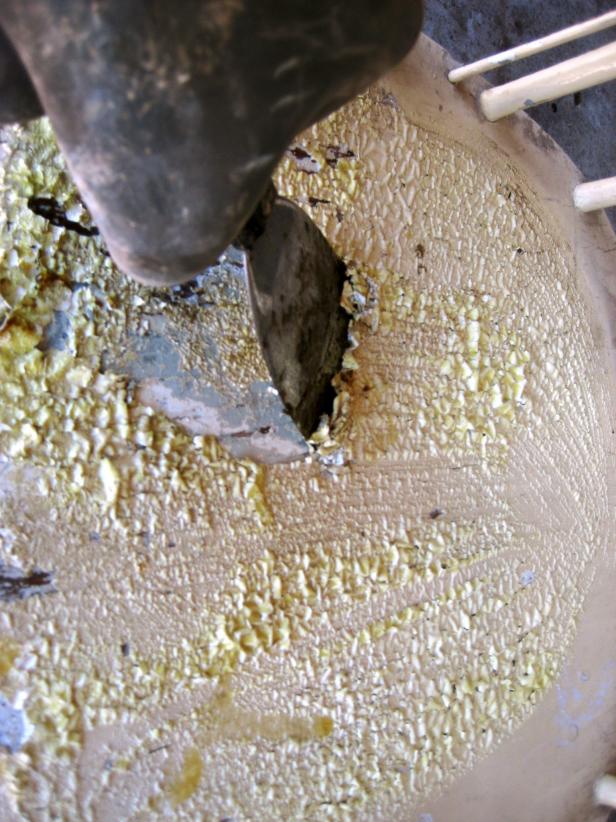 Wait 5 to15 minutes and then use a putty knife to scrape off the paint as it bubbles up. Be sure not to scrape too hard or you may scrape the wood. Work with the grain to prevent gouging the wood. Remove as much of the stripper as possible with the putty knife.