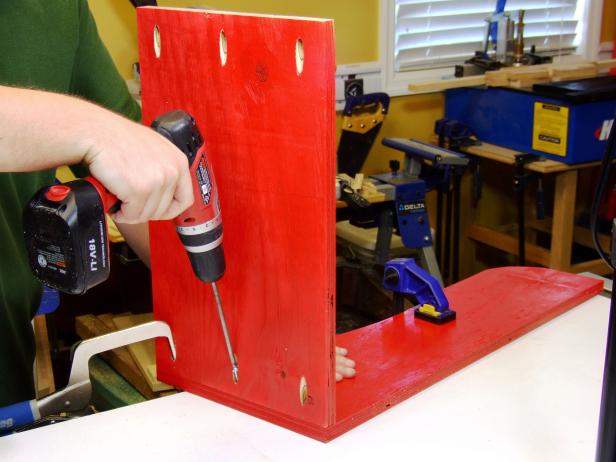 Drill three pocket holes on the ends of the back and front. Position the back flush with the back inside edge of one of the sides and attach using glue and 1-1/4-inch pocket hole screws.