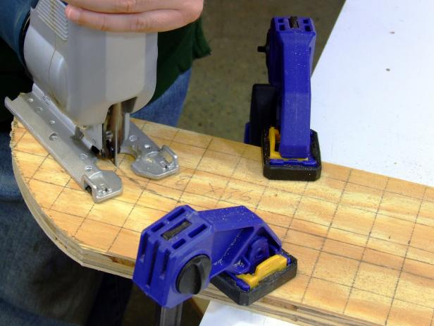 Use a jigsaw to cut the runners. Apply black paint to the runners and allow to dry.
