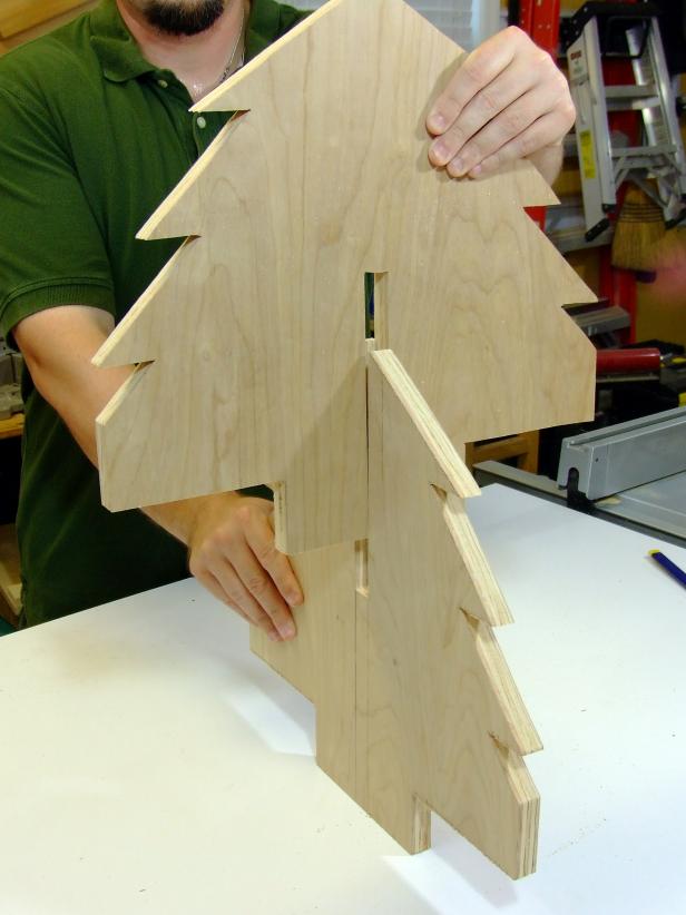 Test fit the Christmas tree sides. If the two parts are too snug, sand down the inside edges of the slots. Sand all edges and corners.