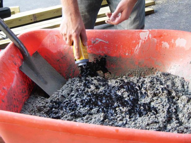 Add water to the concrete and mix with a shovel per the manufacturer's instructions. If you want to add color to the countertop, now’s the time to add pigment to the mix.
