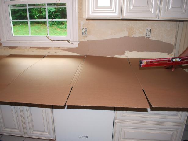 Use cardboard or other thin, cheap material to create your template for your granite countertop. In your template, you must measure the exact locations of cutouts for sinks and cooktops, and holes for faucets and soap dispensers.