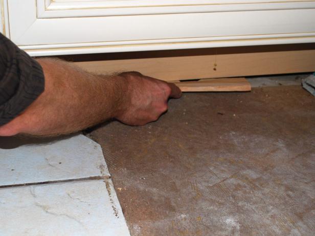Check to make sure your base cabinets are level across their entire length. If not, unfasten the base units and level them with shims underneath the baseboard.