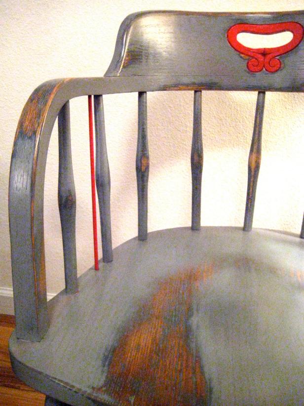 A detail photo of your completed chair after applying 3 to 5 coats of a clear protective finish. Let dry adequately before use. Note the distressed/worn areas.