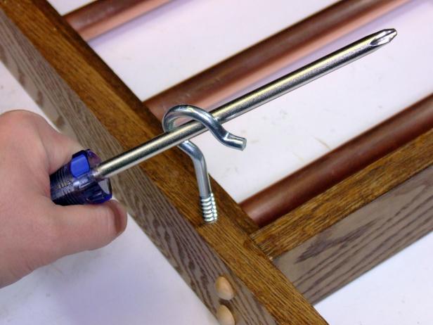 Step Four Finishing Touches and Hanging Hardware Build a Hanging Pot Rack Inserting Screw Hooks