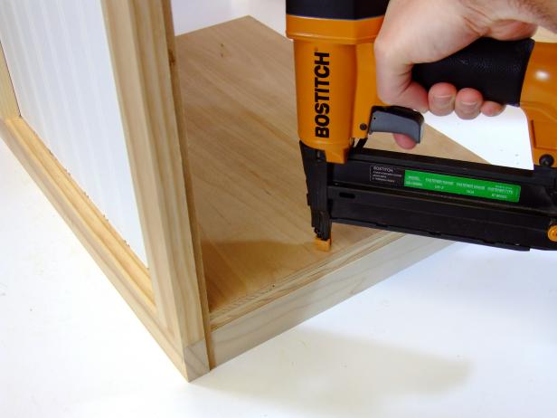 Position the door shelf centered on the shelf rail/stile assembly and flush against the door panel and attach using glue and #18 x 1-1/4-inch brads as shown in Image 3.