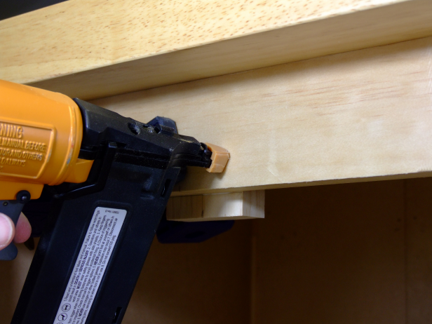 Position the stop centered on the inside of the top side rail and attach using glue and 1-1/4-inch brads as shown in Image 1.