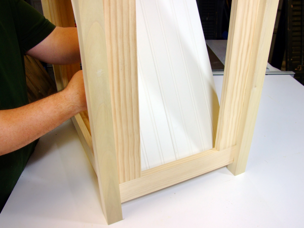 Apply glue to the inside of the end rail assemblies, then slide the wainscot pieces into the assembly (flush with the bottom, Image 2).