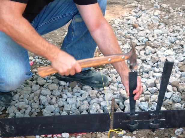 Drive steel stakes into the edging to keep it secure.