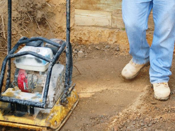 Use a plate compactor to compact the gravel, creating a firm and long-lasting base for the patio.