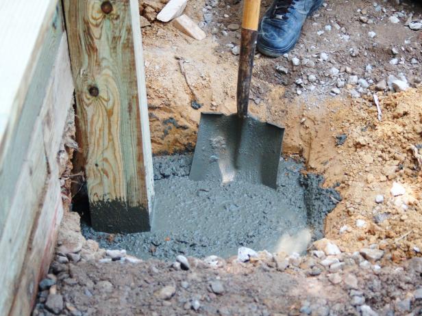 As you fill, use a broom handle, or shovel to "churn" the concrete to ensure that there are no air pockets. If there are, you may need to add more concrete to bring the level to within an inch of the surface.