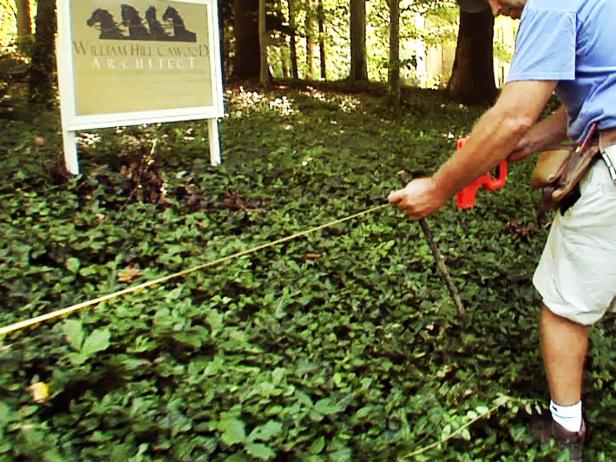 Once the first outside post is set, the other outside post is next. Follow a guide string, and measure 48 feet to the other end, and mark it at that spot.