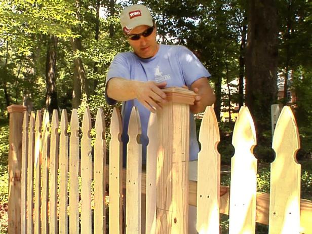 The final step is to cap the fence posts with finials. On each post, measure one inch up from the pickets and continue the mark around the post using a square.