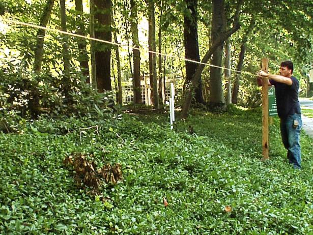 Transfer the guide string from the stakes to the posts themselves to ensure that your outside posts are level.