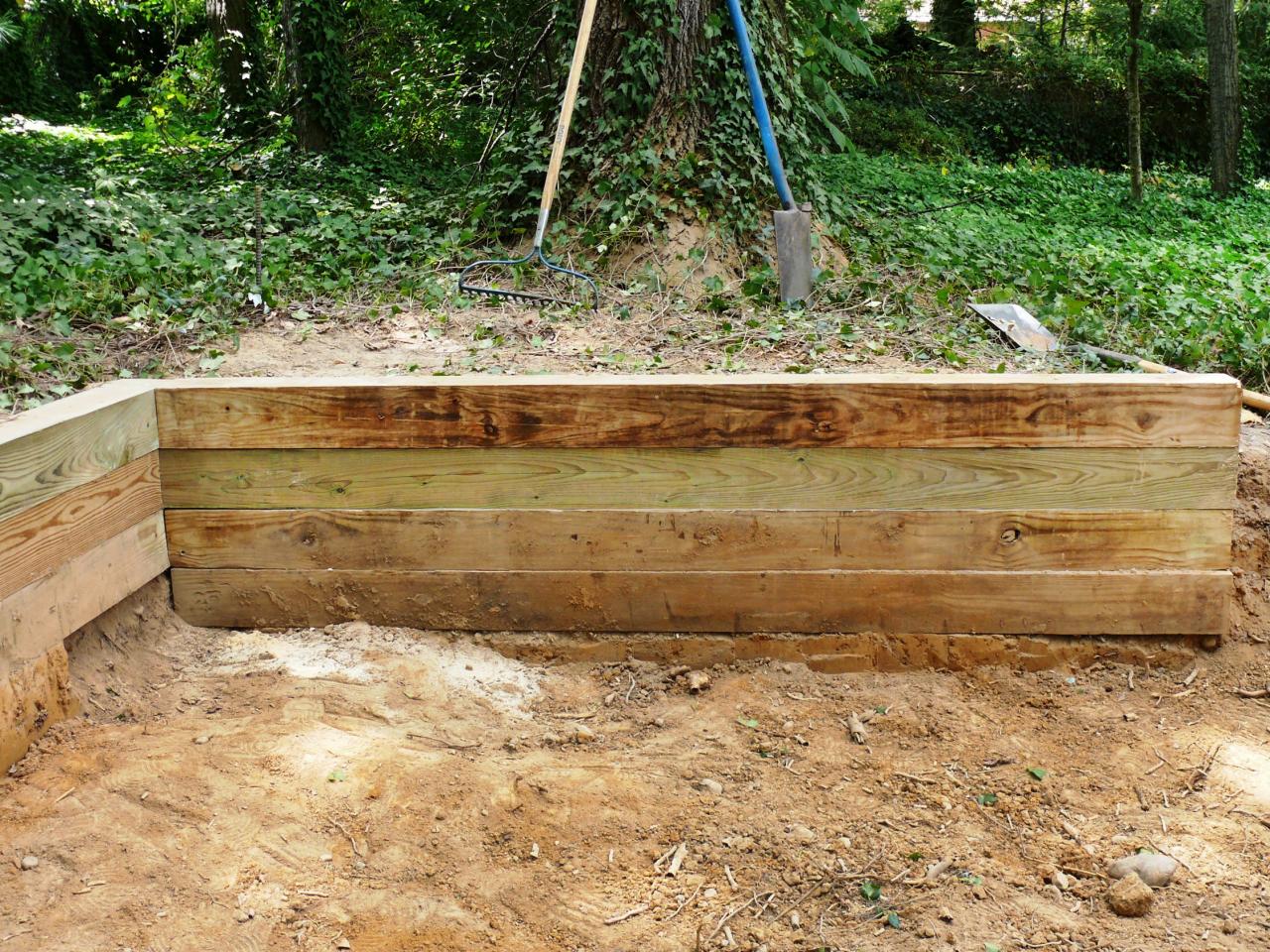 Timber Retaining Wall Design timber retaining wall design idea Cut Planks For An Even Wall Timber Retaining Wall Design free plans woodworking resource from mitre10 free woodworking plans projects patterns landscaping wooden timbers retaining wall Cut Planks For An Even Wall