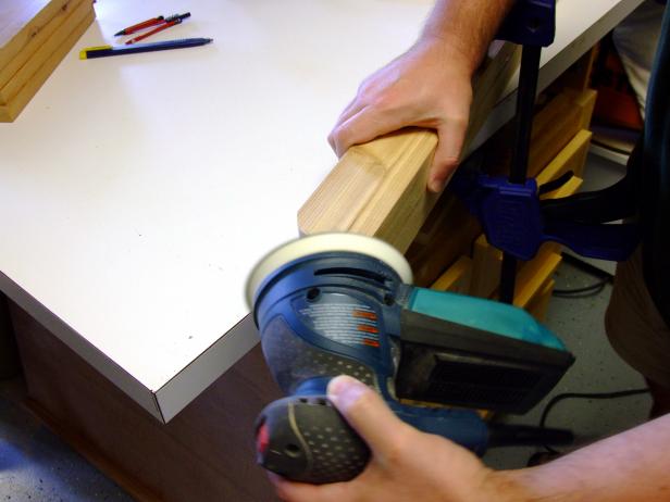 Position the feet with the ends and edges flush, clamp in place, and sand the rounded corners to shape.