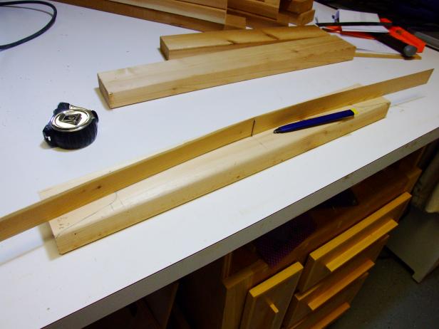 For marking the top arc, use a thin strip of wood or a flexible metal ruler. Drive in nails or brads to hold the wood strip or ruler in place while marking