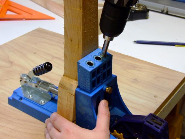 Set the pocket-hole jig and drill bit for drilling into 1 1/2 inch stock and drill the pocket holes in the front aprons.