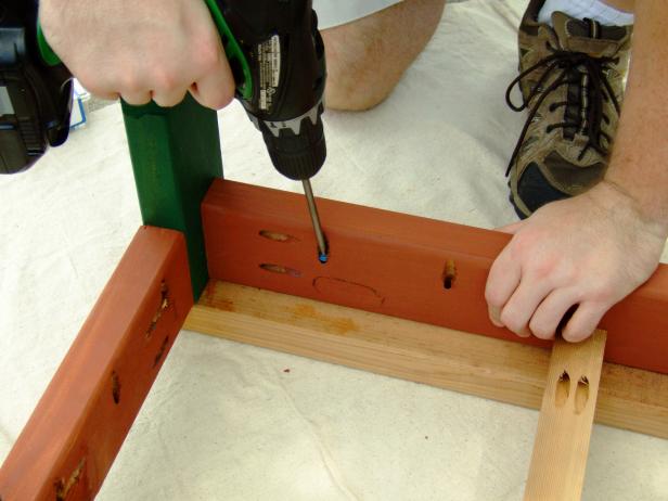 Attach the base assembly side rails and back rails to the innermost and outermost seat slats using 2-1/2" pocket-hole screws only.