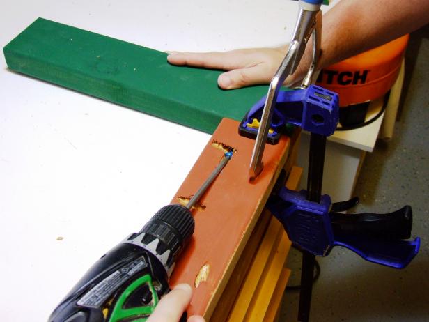 Position an end apron flush against two legs and attach using glue and 2-1/2" pocket-hole screws.