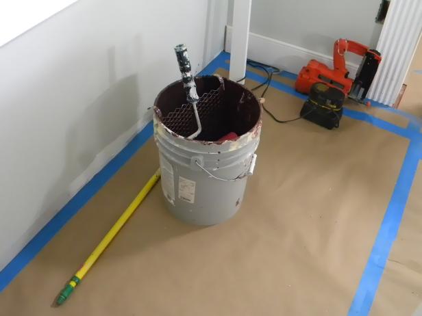 Pour the remains of the edging paint into the paint tray. Wash the brush and paint container with warm soapy water. Set aside to dry.