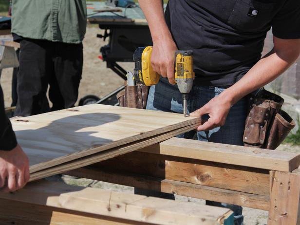 Measure the dimensions for the bar top, allowing for a 2" overhang in front. Cut two pieces of 3/4" plywood to fit the top. Screw the pieces together to create a 1 1/2" thick bar top.