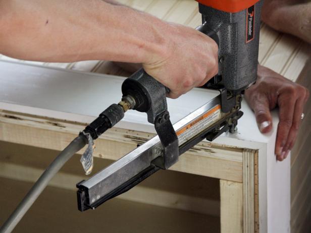 Use a finish nail gun or brad nail gun to secure the baseboard in place.