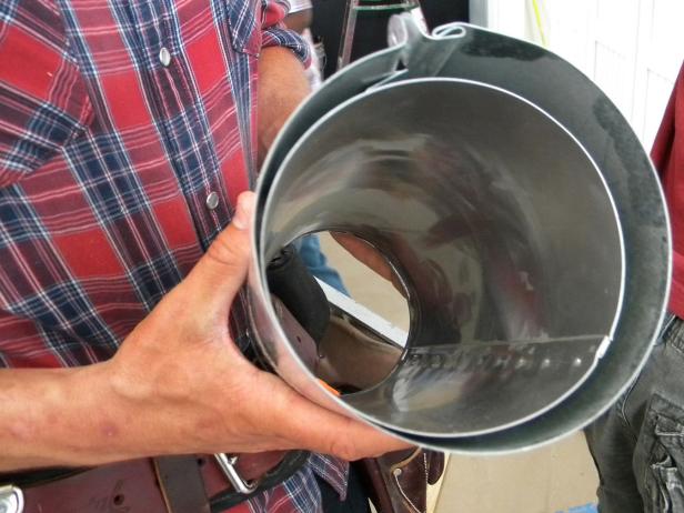 Hold a few galvanized double wall heat ducts up to a side cabinet or nook to test for wine bottle depth.