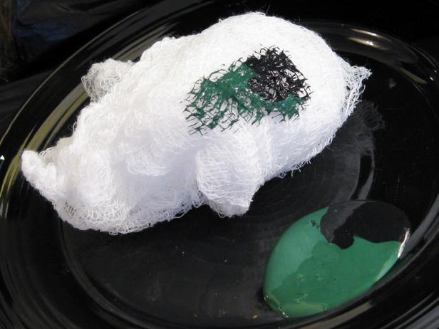 Mix black and green paint and apply with cheese cloth.