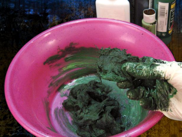 With a gloved hand, gently mix the lint and liquids until all are moss-colored.