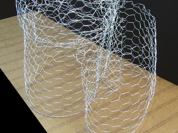 Use wire to attach one piece to bottom of torso and the second to the backside of the first piece, slightly squished.